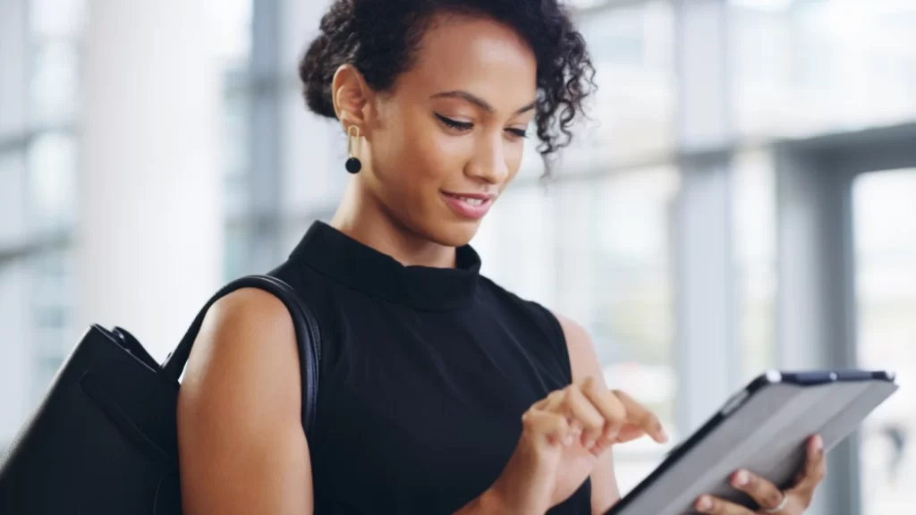 Woman writing on tablet
